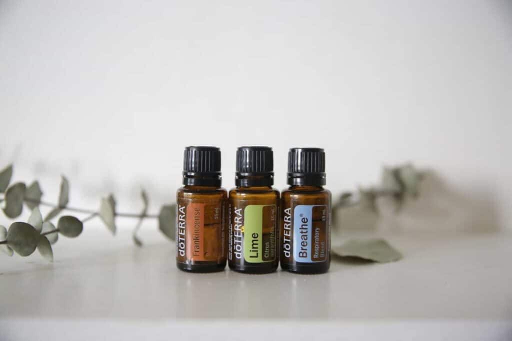 3 bottles of DoTERRA essential oils on table