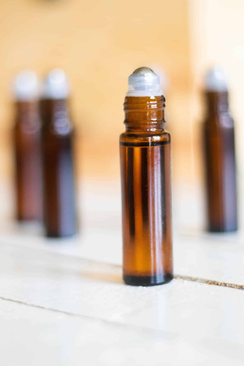 10mL amber glass roller bottle on white table