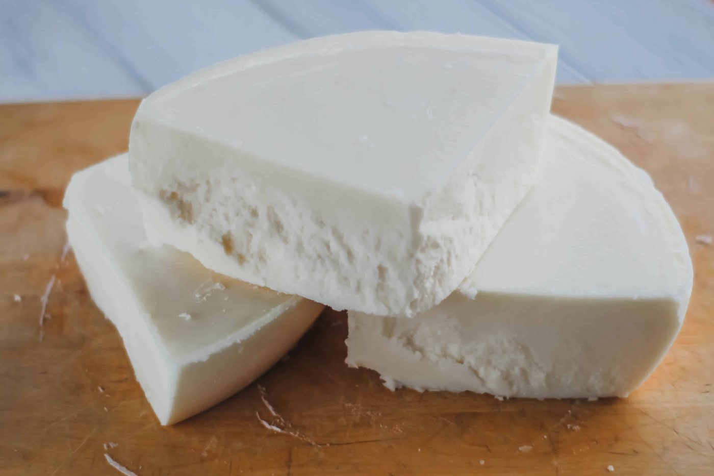 Beef tallow chunks on wooden cutting board.