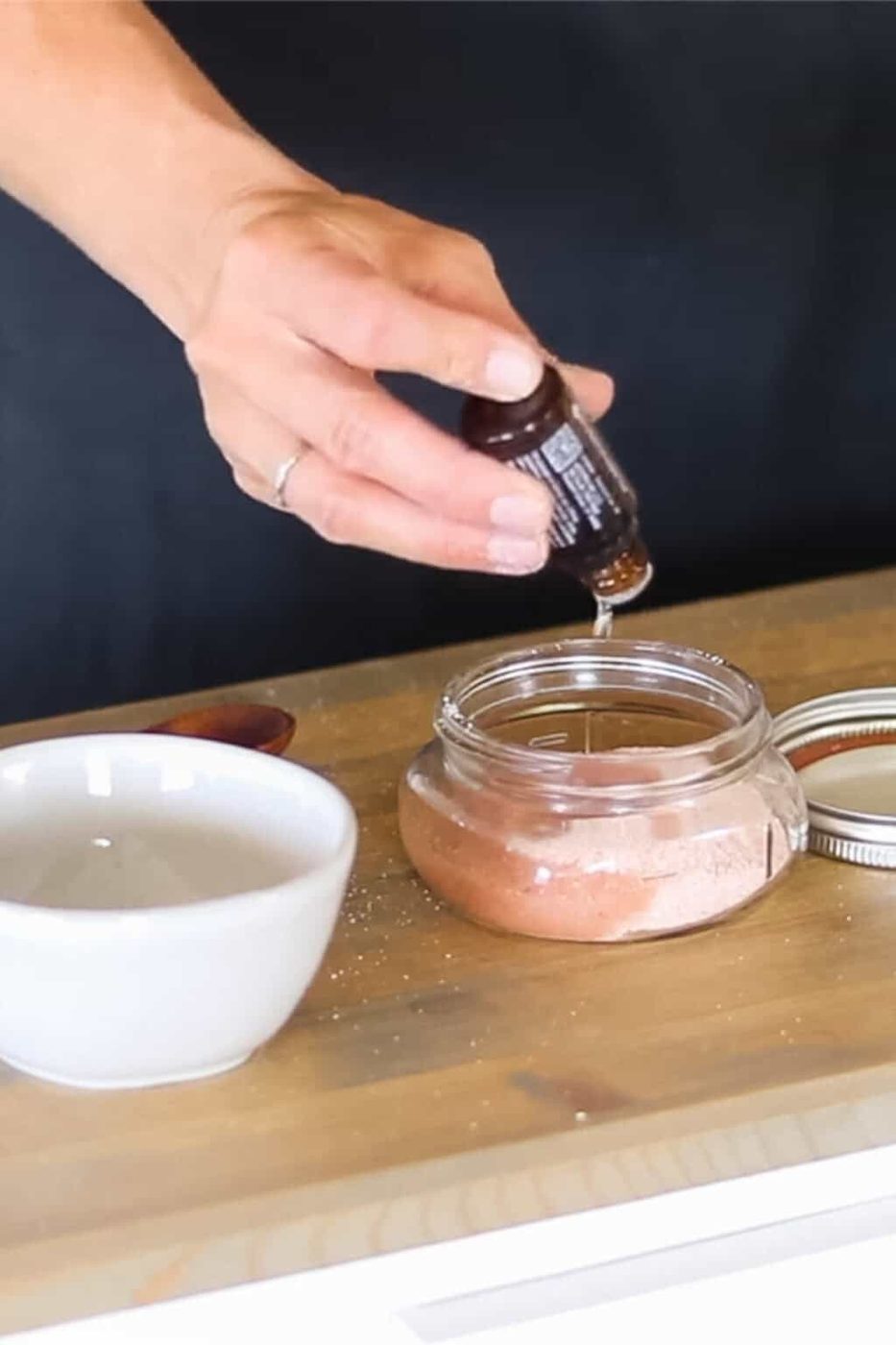 Adding peppermint oil to the foot scrub DIY.