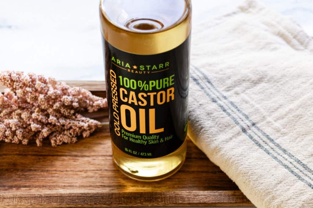 A large bottle of castor oil to use in skin care products like face cleansers.