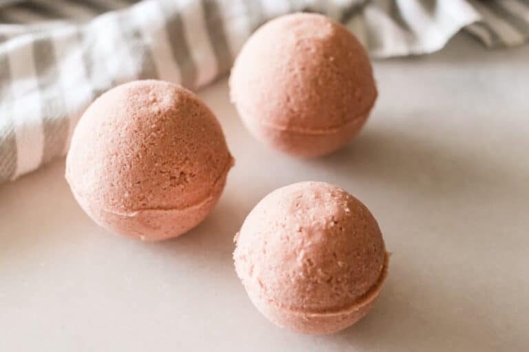 Homemade bath bombs on white marble.