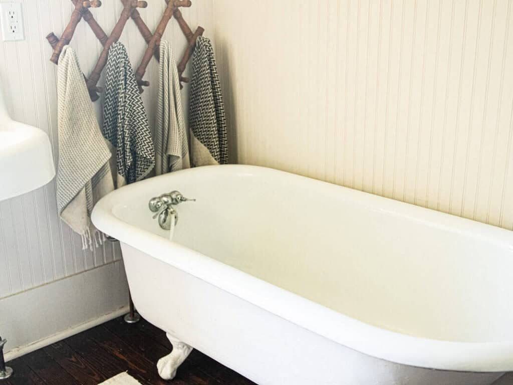A claw foot bathtub in a bathroom.