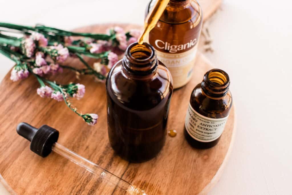 Adding the ingredients to an amber colored dropper bottle.