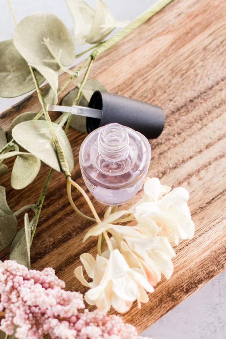 Using a cuticle oil to hydrate our toenails.