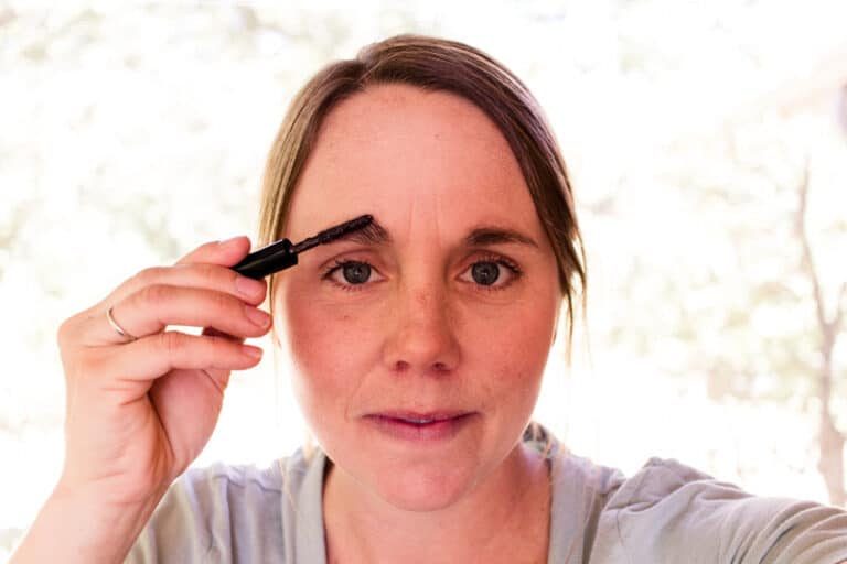 the studio applying her DIY eyebrow gel.
