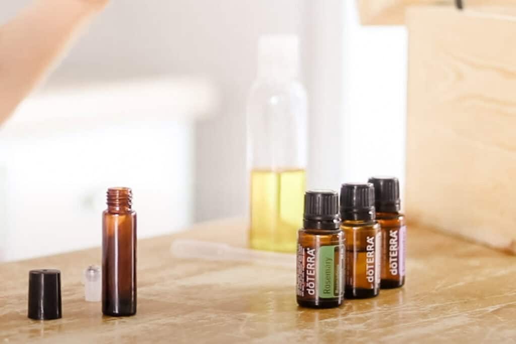 Ingredients to make a growth serum for the brows on a wooden table.