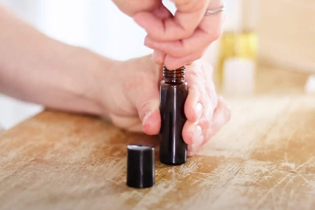 Securing the rollerball top for the growth serum.