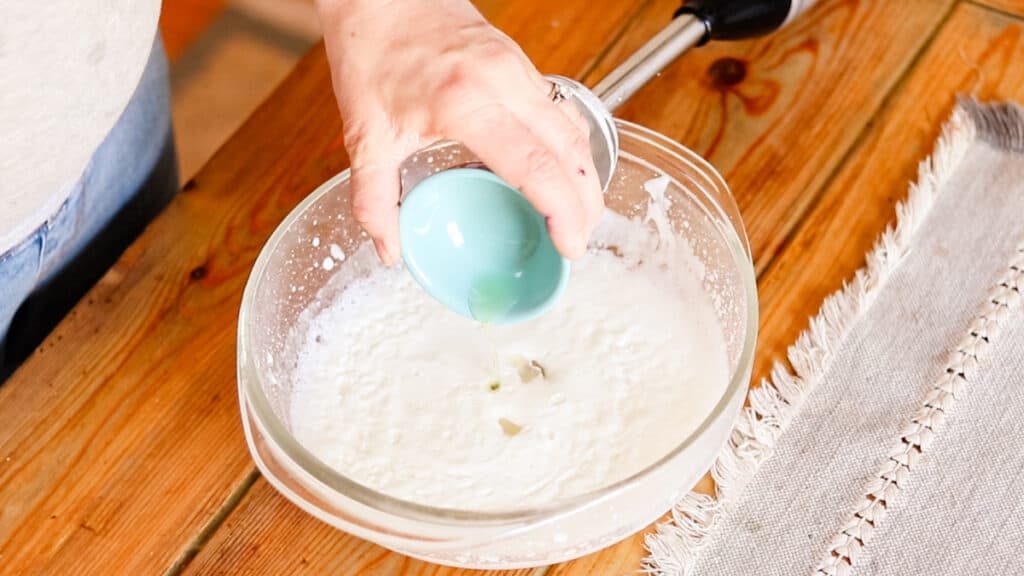 Adding the fragrance to the foot lotion after the water and oils have been combined.