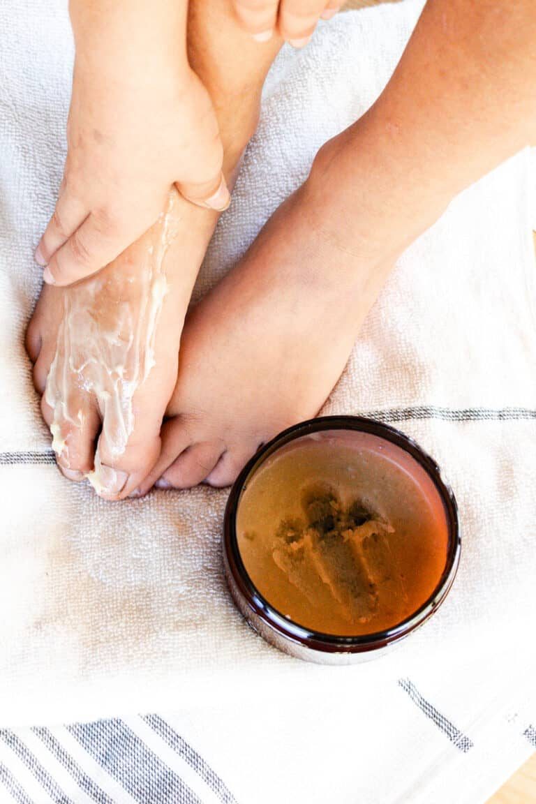 Applying a DIY foot mask.