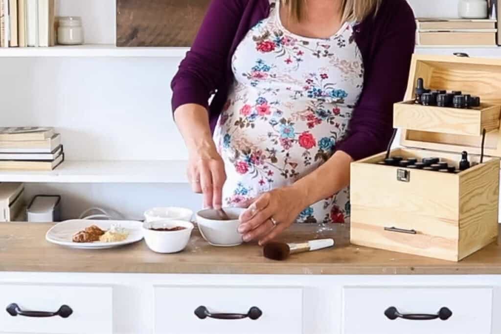 Stirring ingredients together to make DIY foundation.