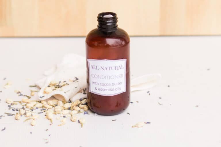 Homemade hair conditioner on marble vanity.