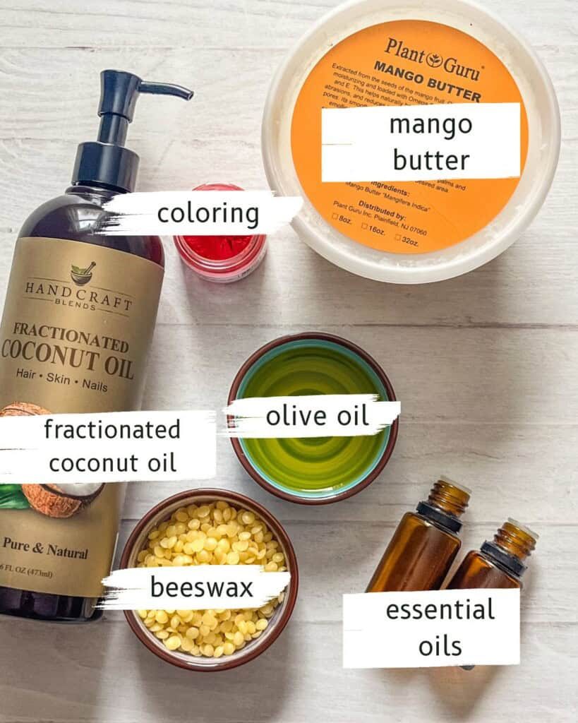 DIY lip gloss ingredients on a white table.