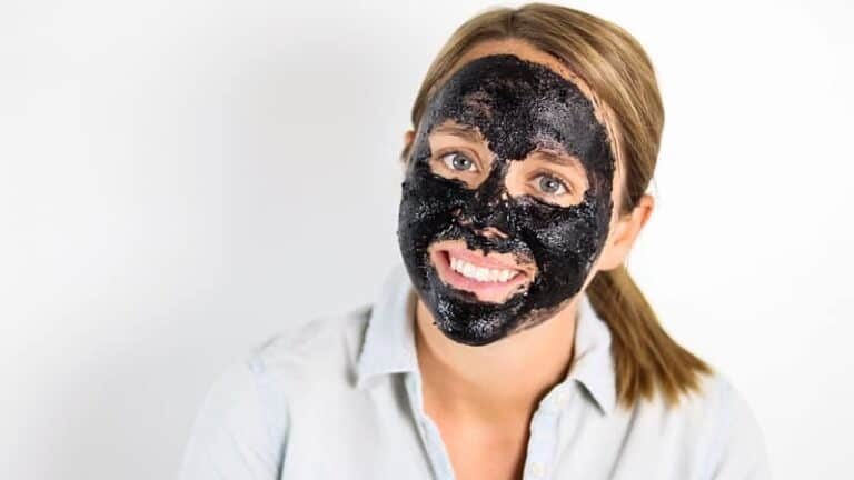 Homemade charcoal face mask on women's face.