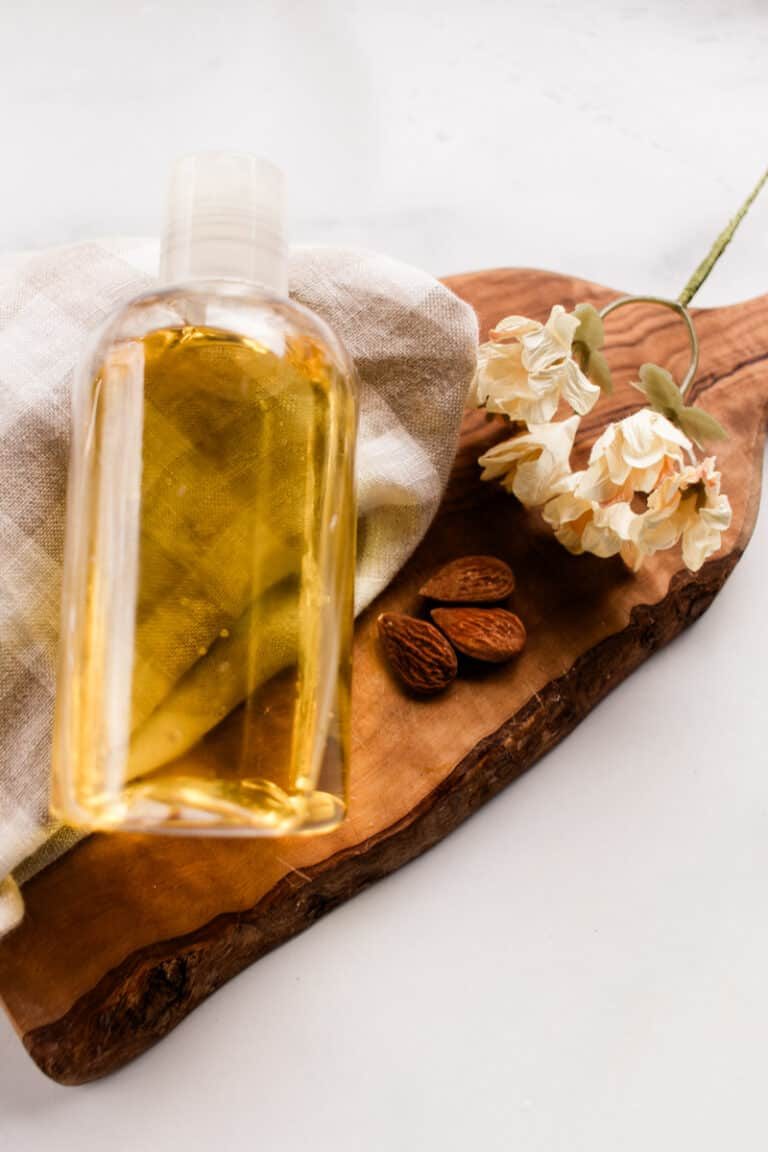 A moisturizing shower oil in a clear bottle made up of hydrating oils.