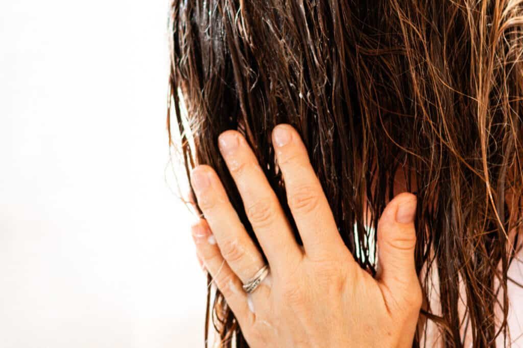 Rubbing the epsom salt shampoo into our hair gently.