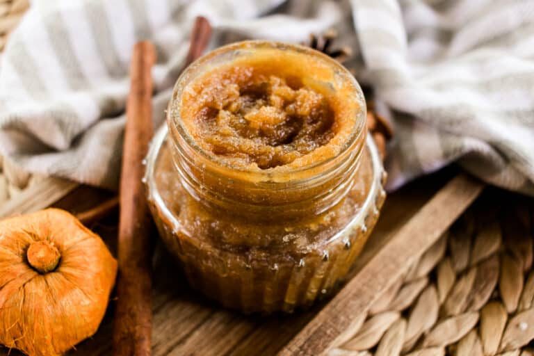 Fall body scrub with a pumpkin and a cinnamon stick.