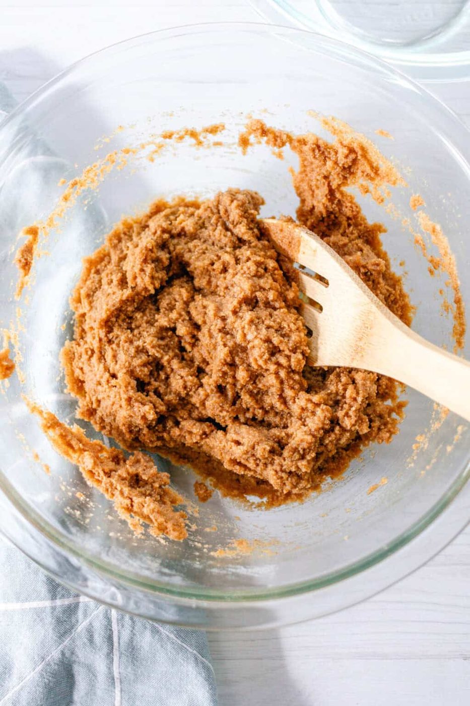 Stirring the batter together in glass bowl with a wooden spoon.