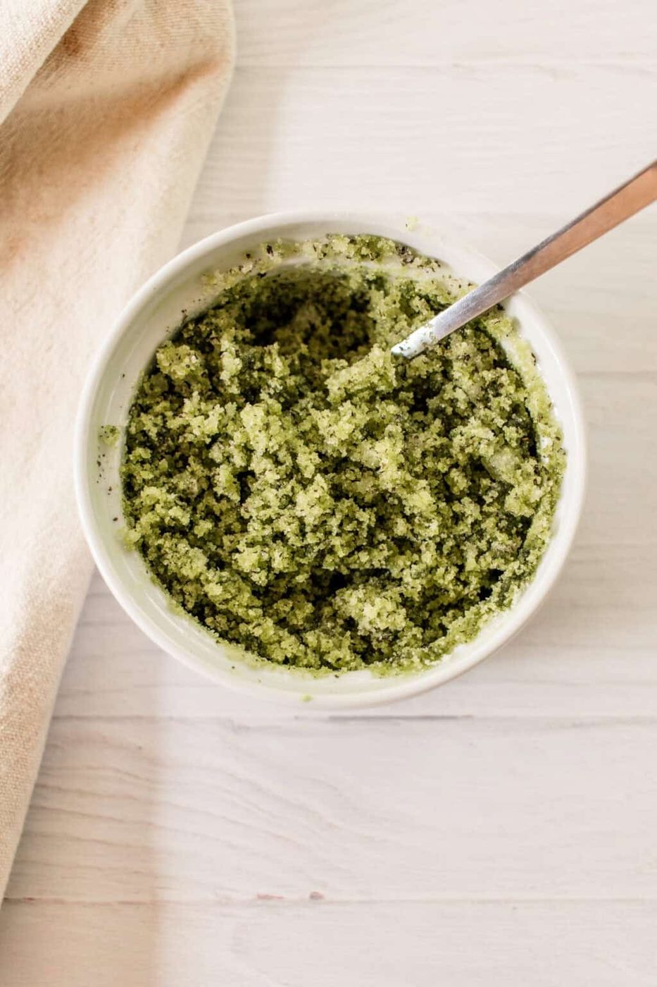 Green tea matcha scrub in a bowl after being stirred.