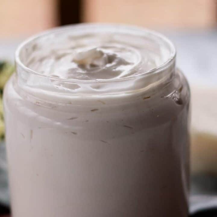 Homemade hair butter in a glass jar.