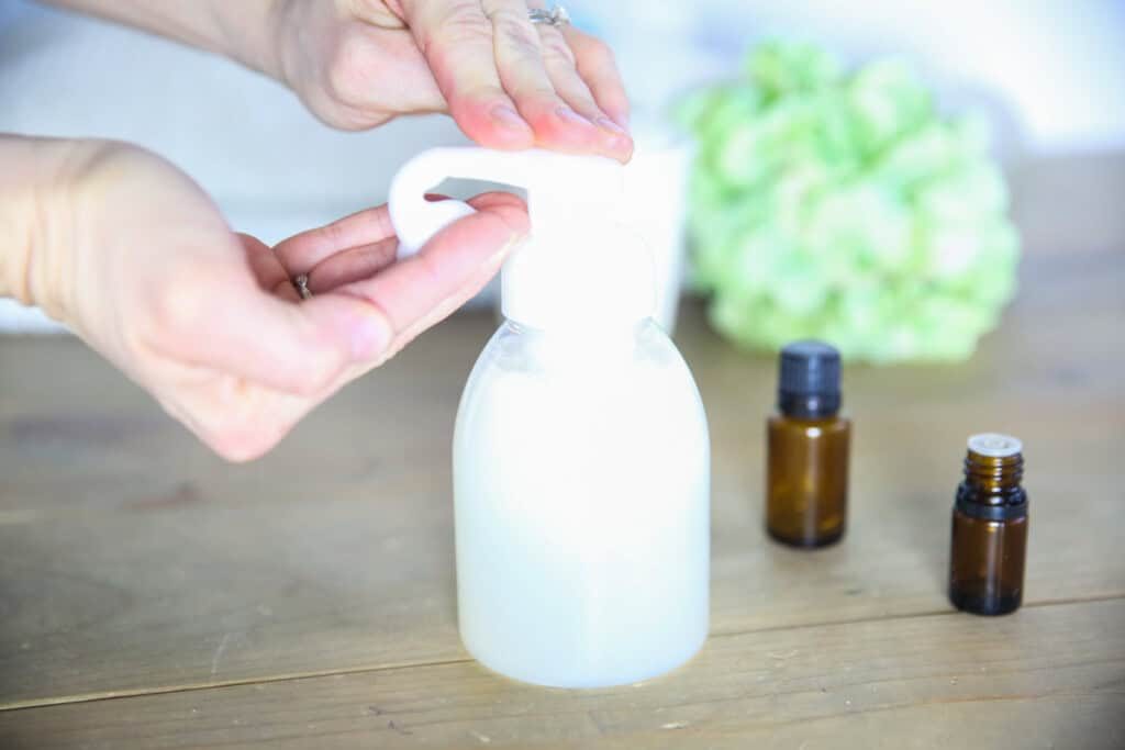 Dispensing some natural baby wash into the hand.