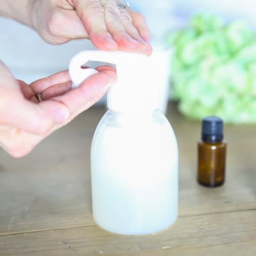 Dispensing some natural baby wash into the hand.