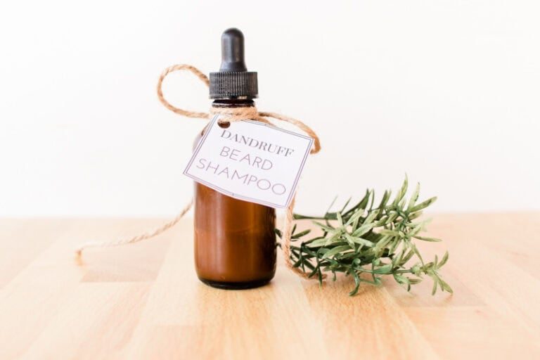 Homemade beard anti-dandruff shampoo in dropper bottle with printable label attached with hemp.