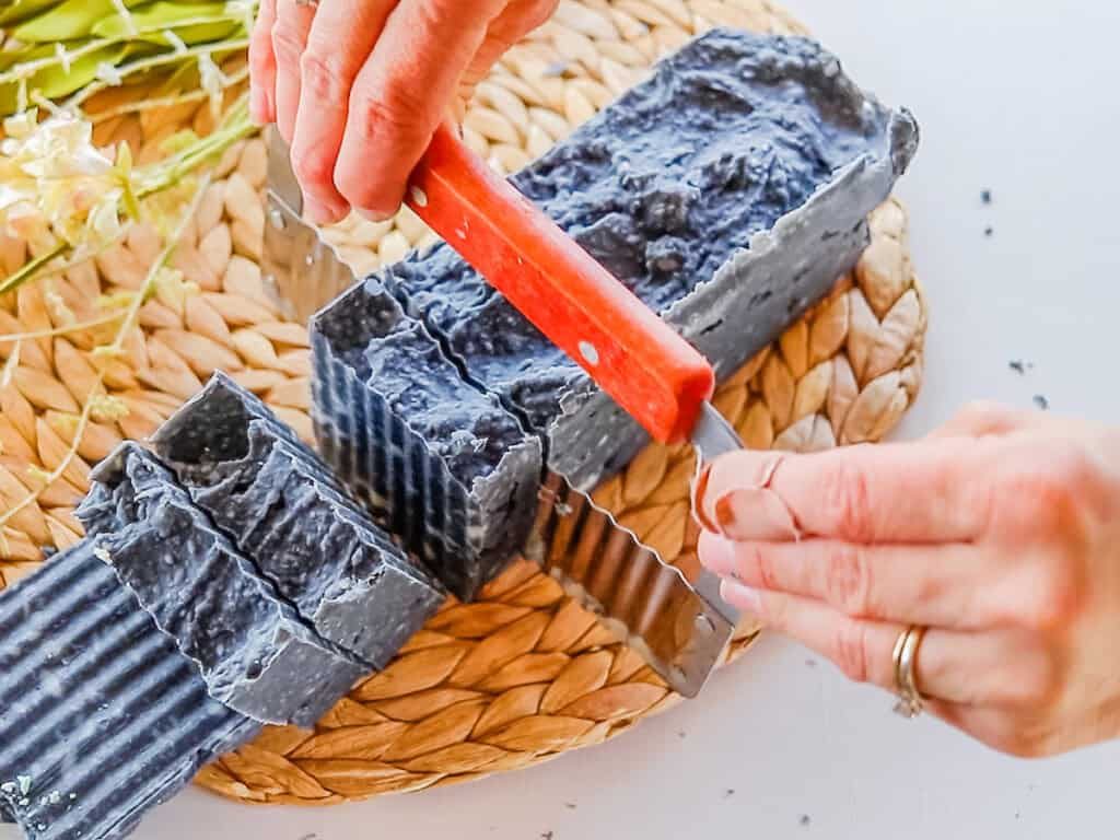 Cutting a loaf of soap into individual bars.