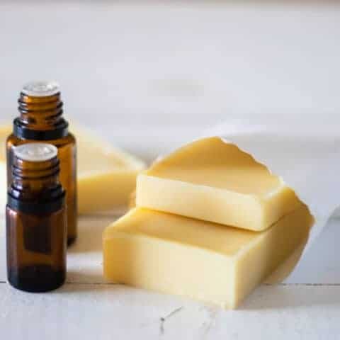 Homemade conditioner bars in a white storage pouch.