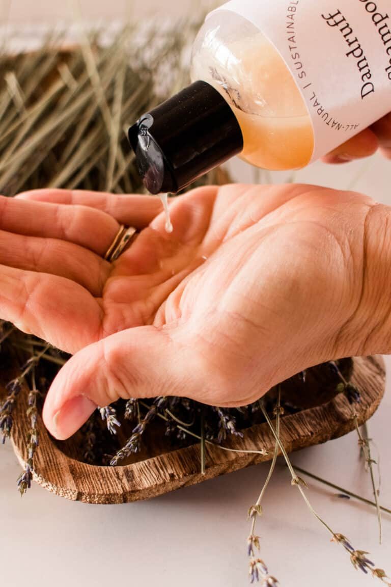 Pouring homemade dandruff shampoo on the hands.
