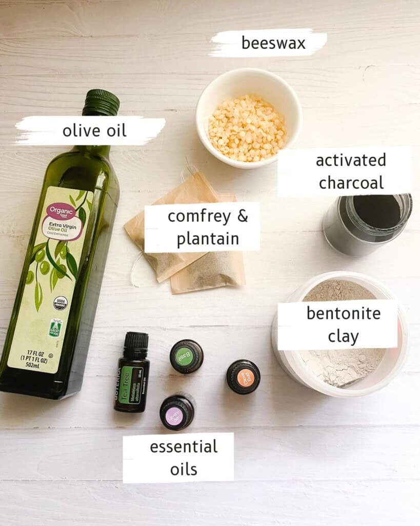 Homemade drawing salve ingredients labeled on a white table.