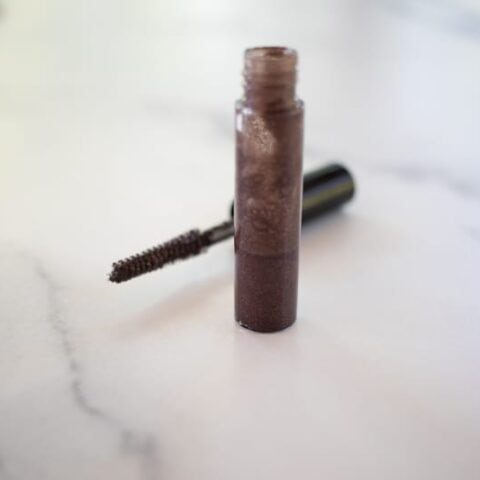 Diy eyebrow gel in a small glass container.