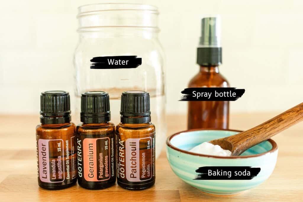 Homemade febreze ingredients assembled on a wooden table.