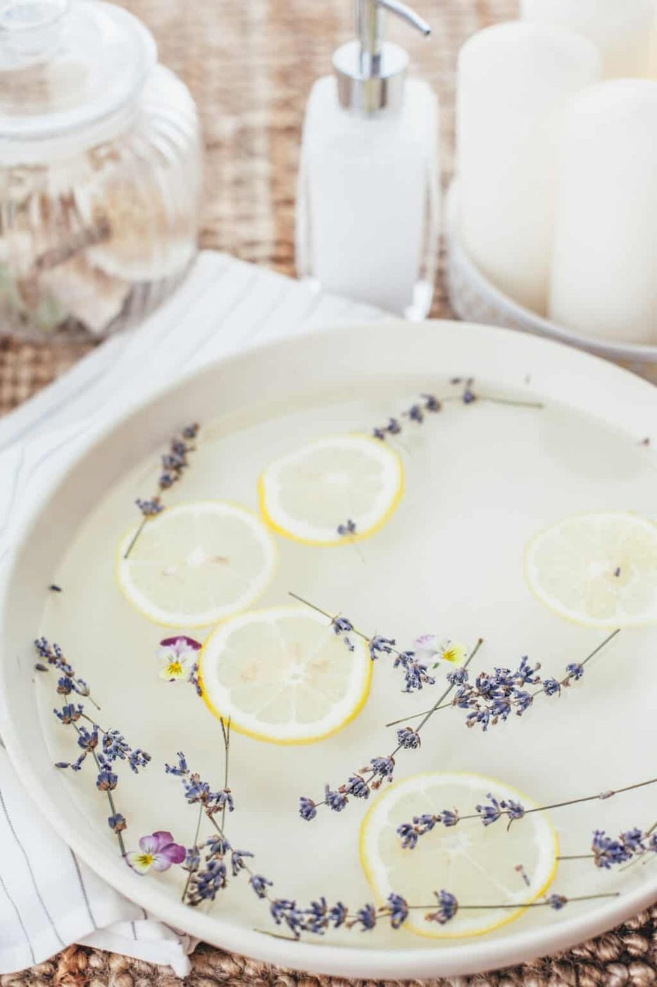 A foot soak with dried lavender and lemon slices.