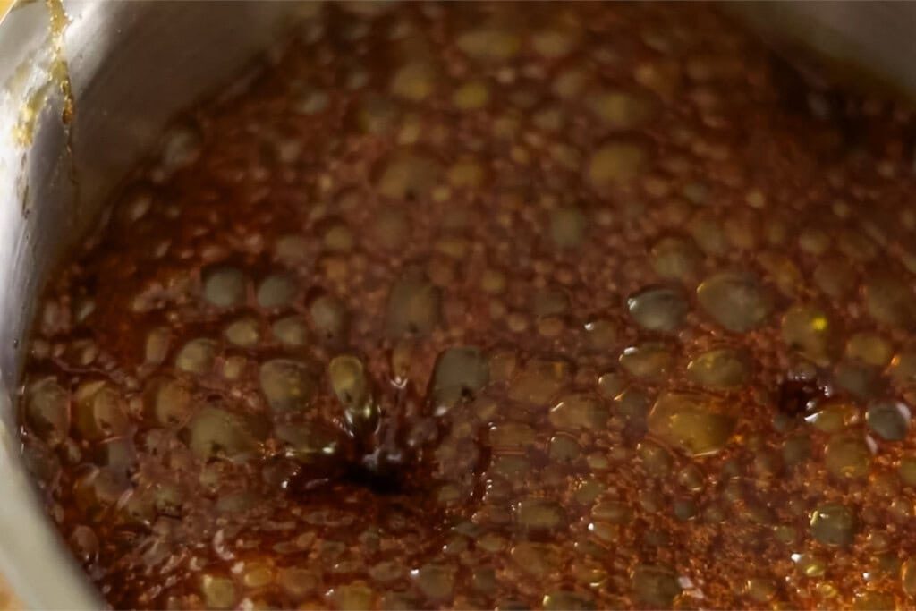 Lollipop mixture boiling in the saucepan.