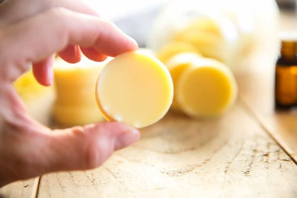 Selecting a lotion bar to apply to the hands.