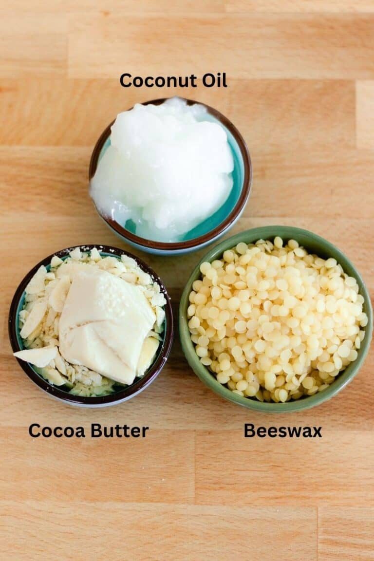 Three bowls of lotion bar ingredients: coconut oil, beeswax, and cocoa butter.