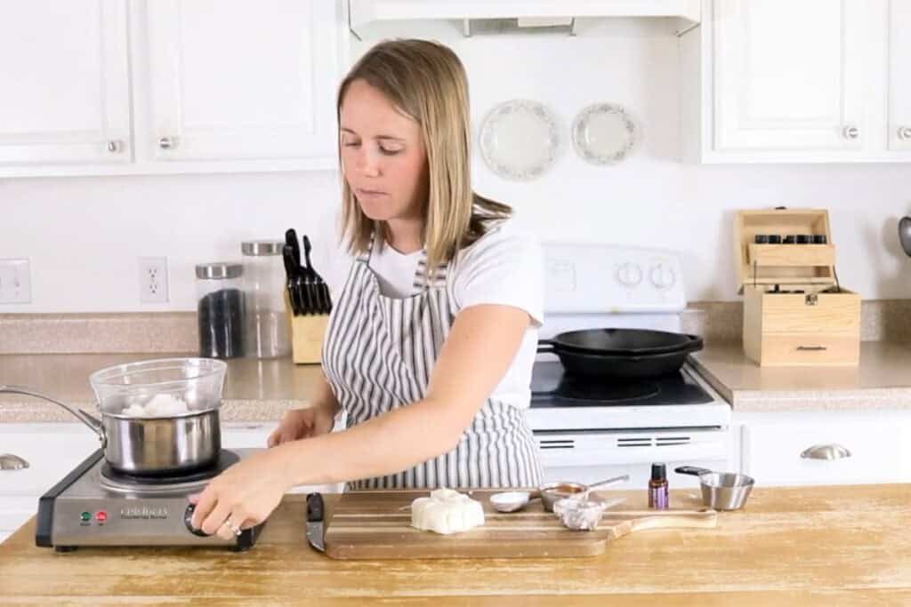the studio melting ingredients in a double boiler.