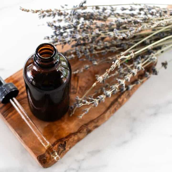 A homemade tanning oil on a marble counter.