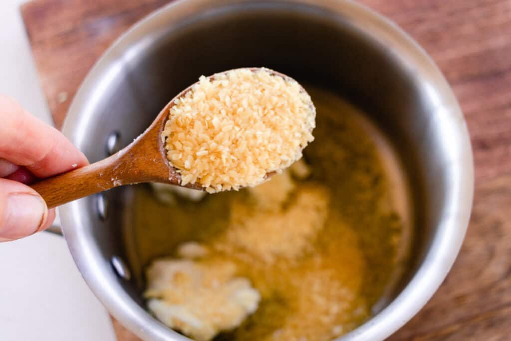 Adding candellila wax to the vegan lip balm recipe.