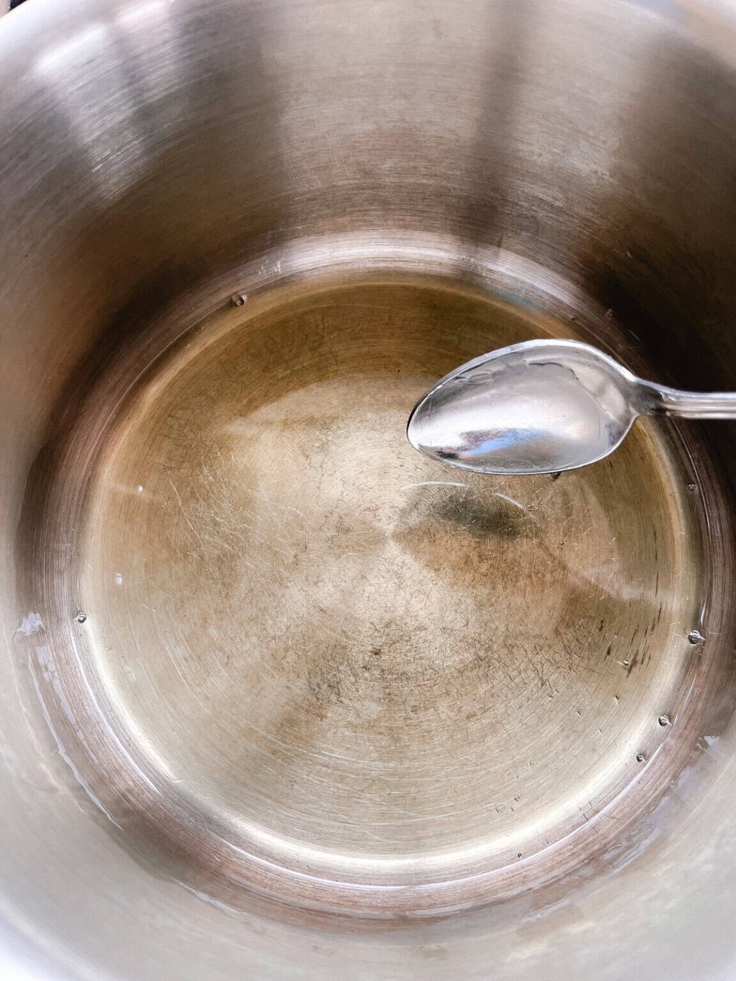 Stirring melted ingredients in a double boiler.