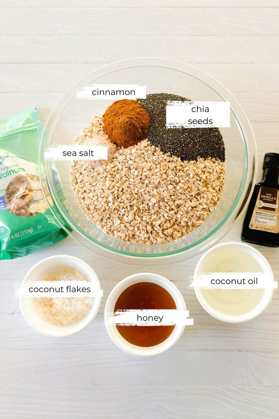 Homemade honey granola ingredients on a white countertop.