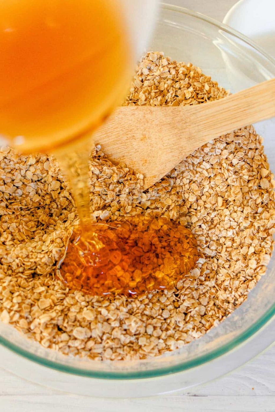 Pouring the wet ingredients into the dry ingredients.