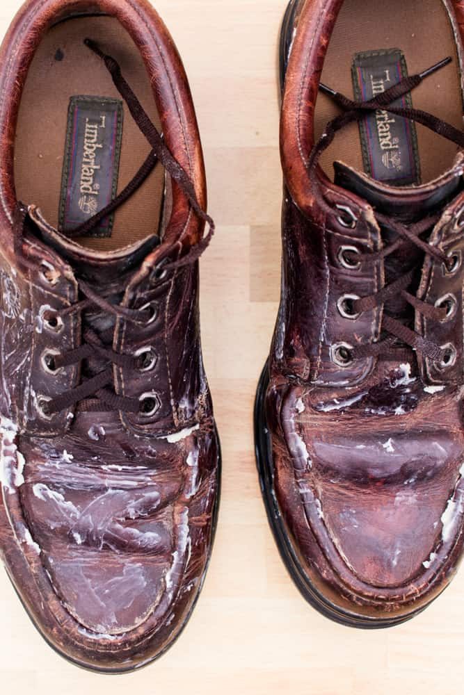 Brown leather dress shoes lathered in leather conditioner.