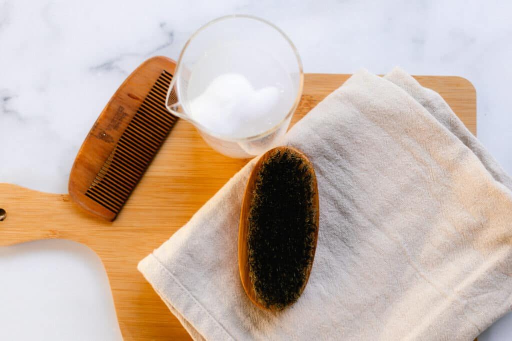All the necessary supplies lined out to clean a dirty beard brush.