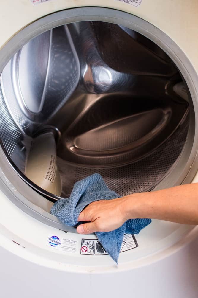 Cleaning the washer seal with a microfiber cloth.
