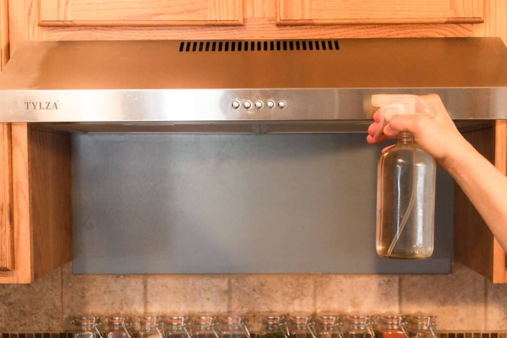 Cleaning a range hood.