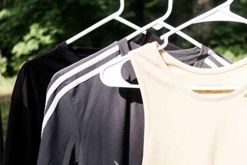Hanging workout clothes outdoors to dry.