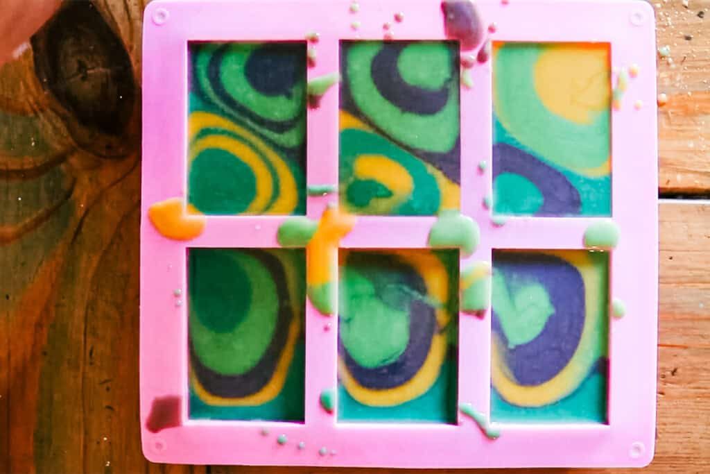 Colorful swirly soap in a silicone soap mold.