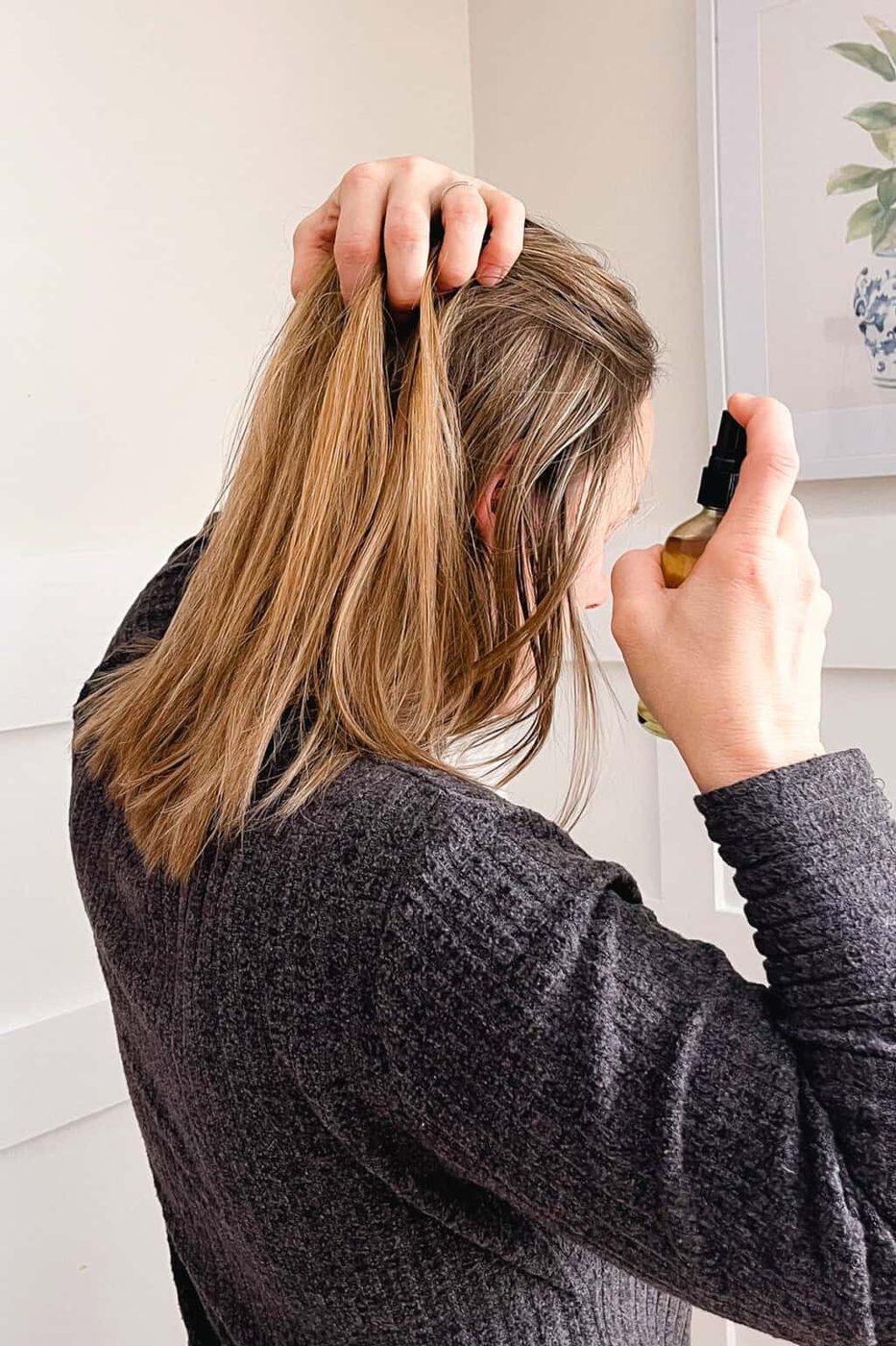 Lightly Spraying Rosemary water into our hair.